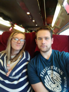 man and nursing woman on train