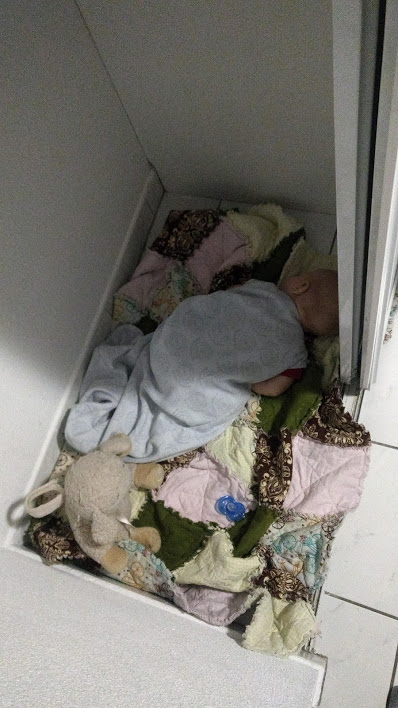 baby sleeping in closet