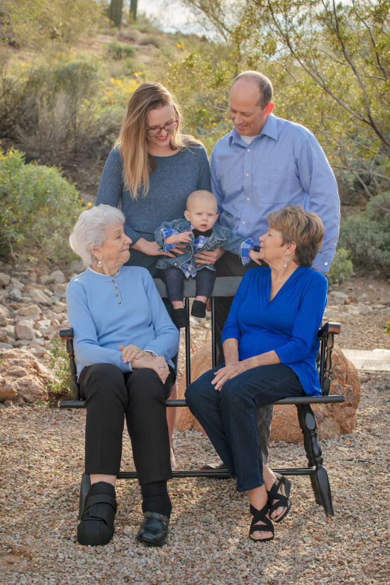 five generation smiling family photo