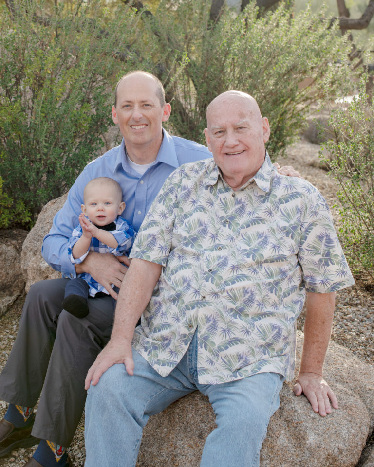 grandpa, dad and baby smiling