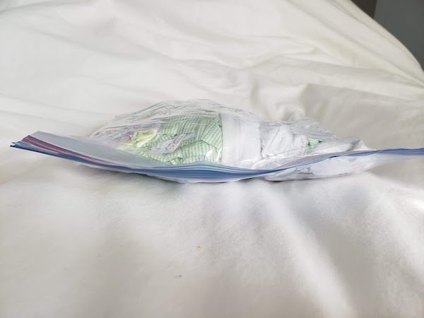 diapers compacted in ziploc to fit in diaper bag for flight