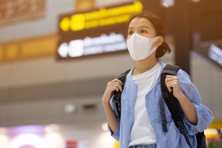 girl with mask at airport